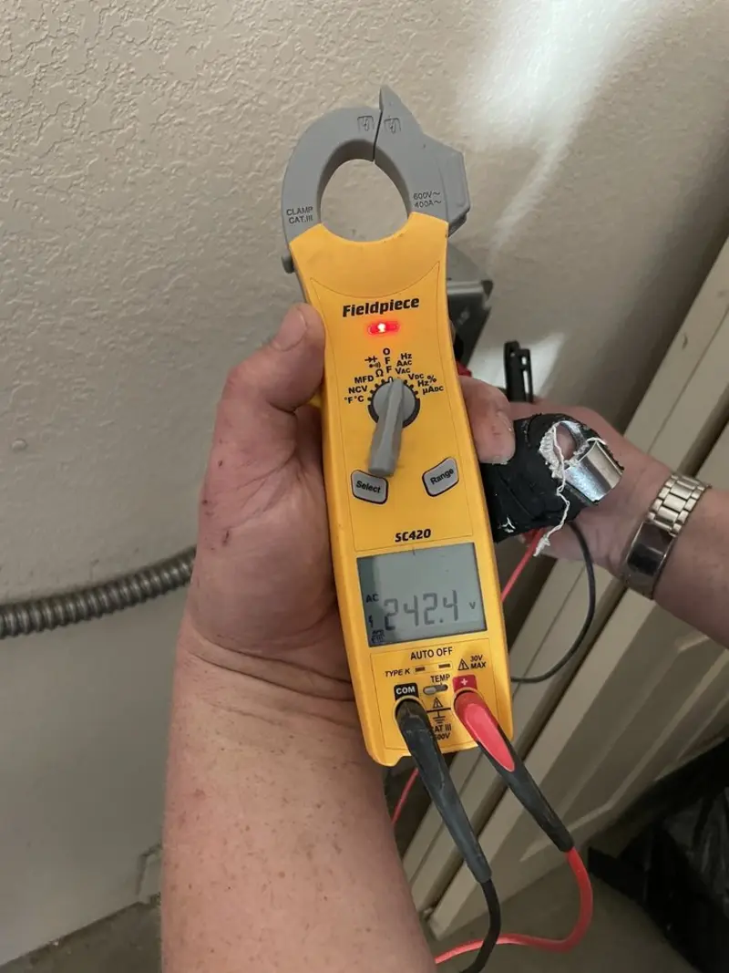 Voltage testing with clamp meter during Whole House Surge Protector in Ballston Spa